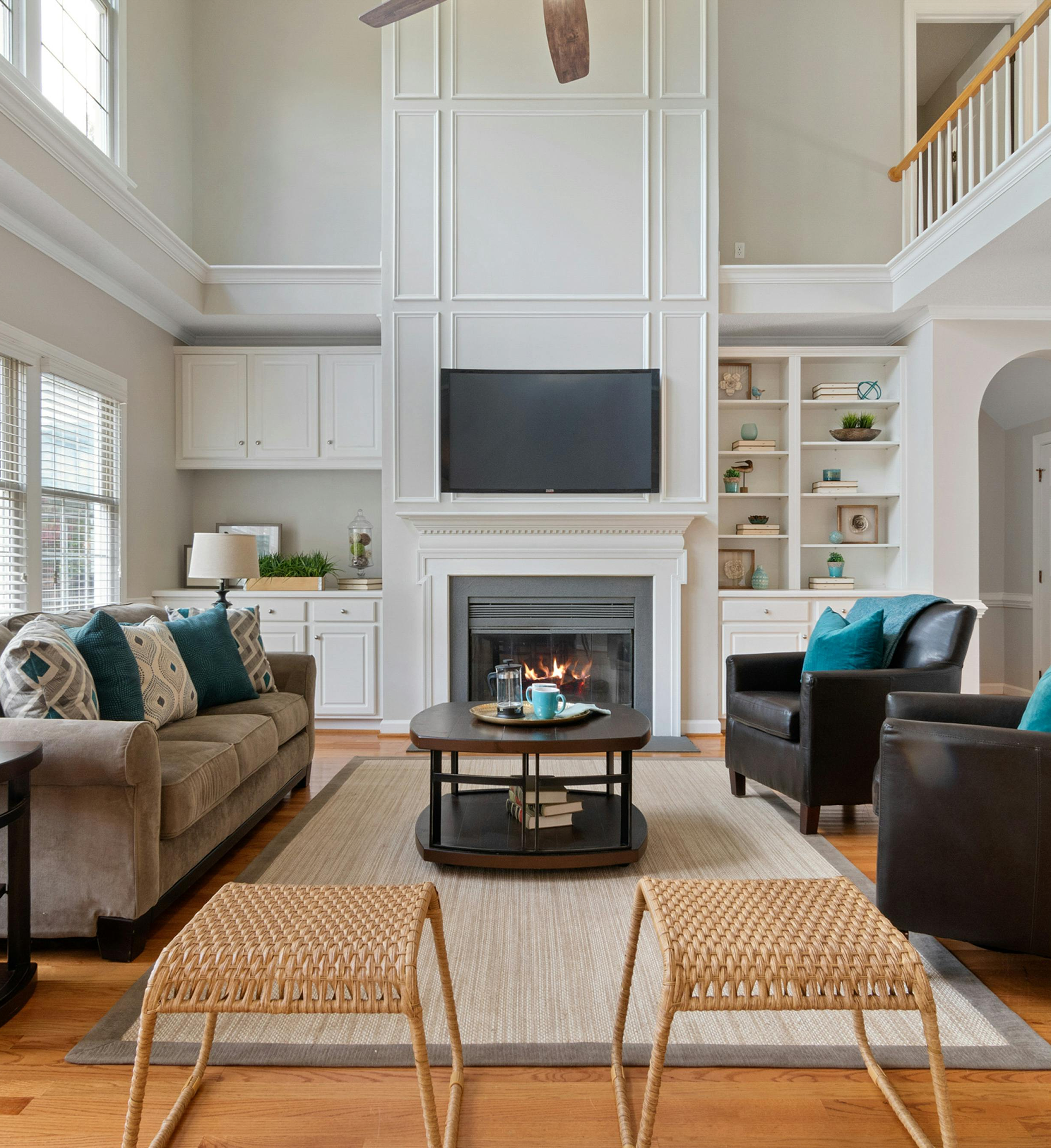Living room with a fireplace, couch, chairs, and coffee table.