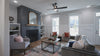 Modern living spacing with blue fireplace and bright windows